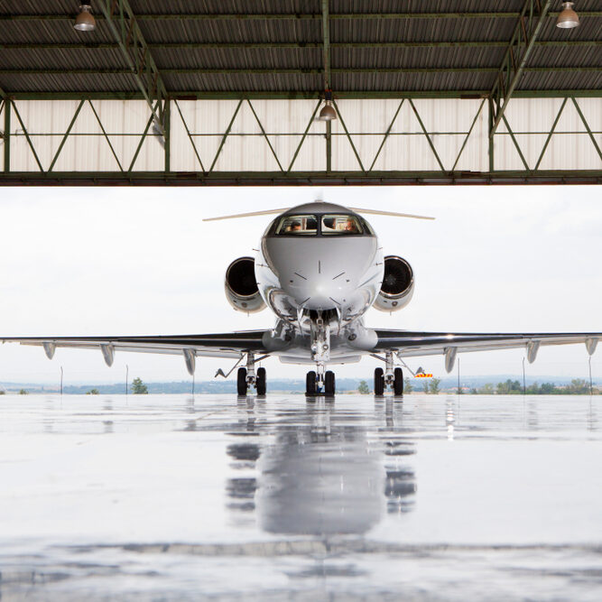 Pilots,In,Private,Jet,In,Hangar