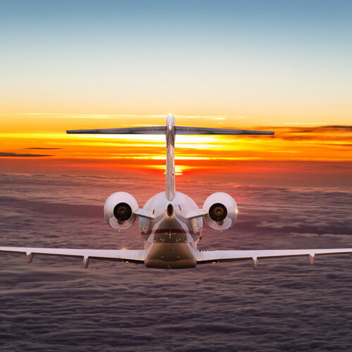 Small,Private,Jetplane,Flying,Above,Beautiful,Clouds.,Travel,And,Transportation